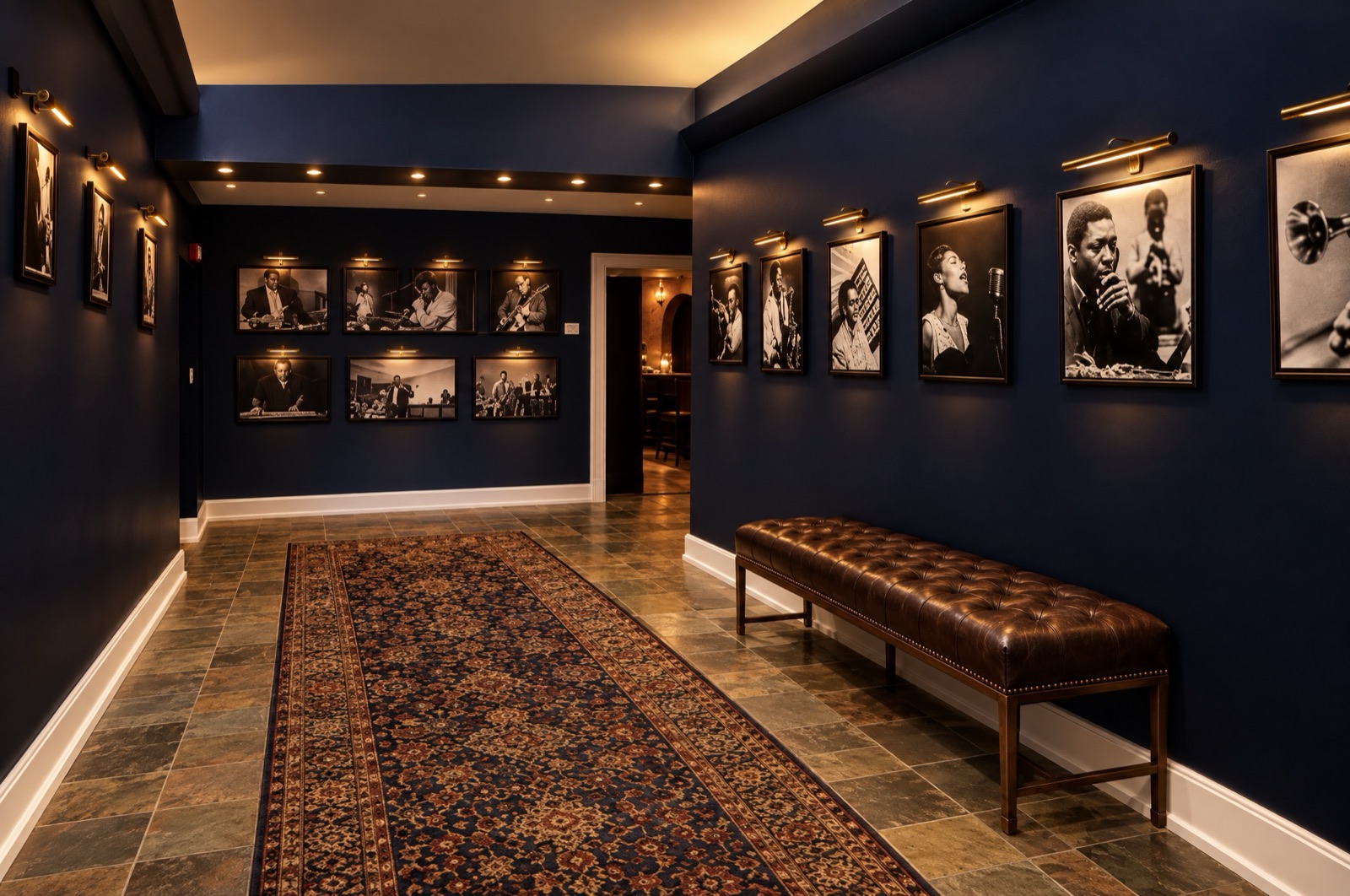 The gallery corridor hung with jazz portraits